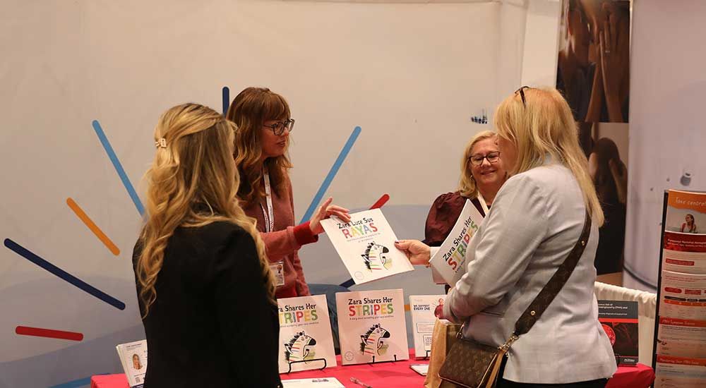 Corporate Partner handing out flyer at event